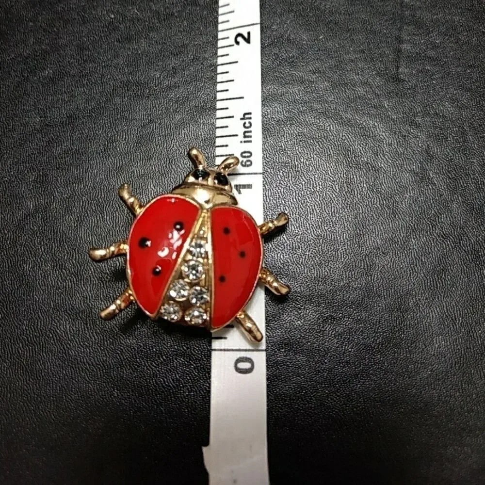 Gold tone and red enamel ladybug pin brooch